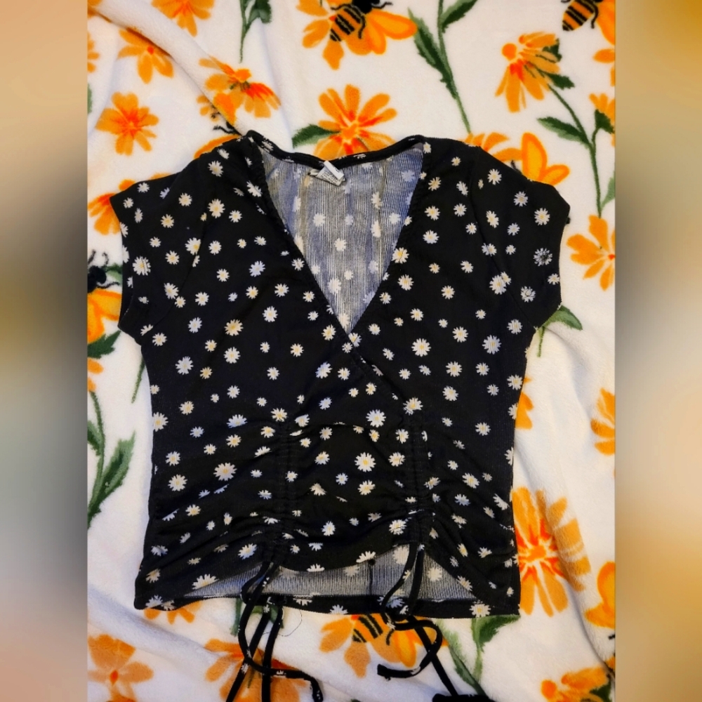Black crop top with daisies with cinched front size large from rue21